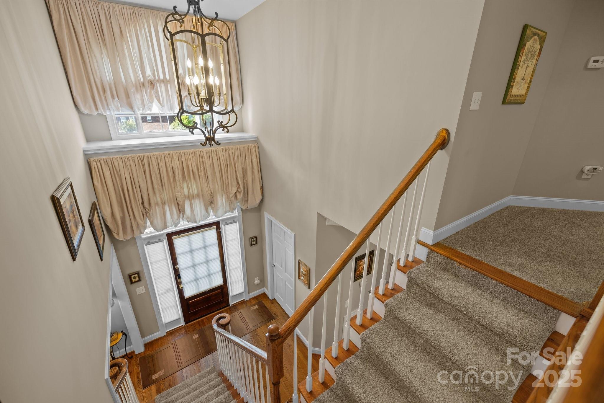 204 Limerick Drive Matthews, NC 28104 - Photo 33 of 44 a view of staircase with white walls and a window