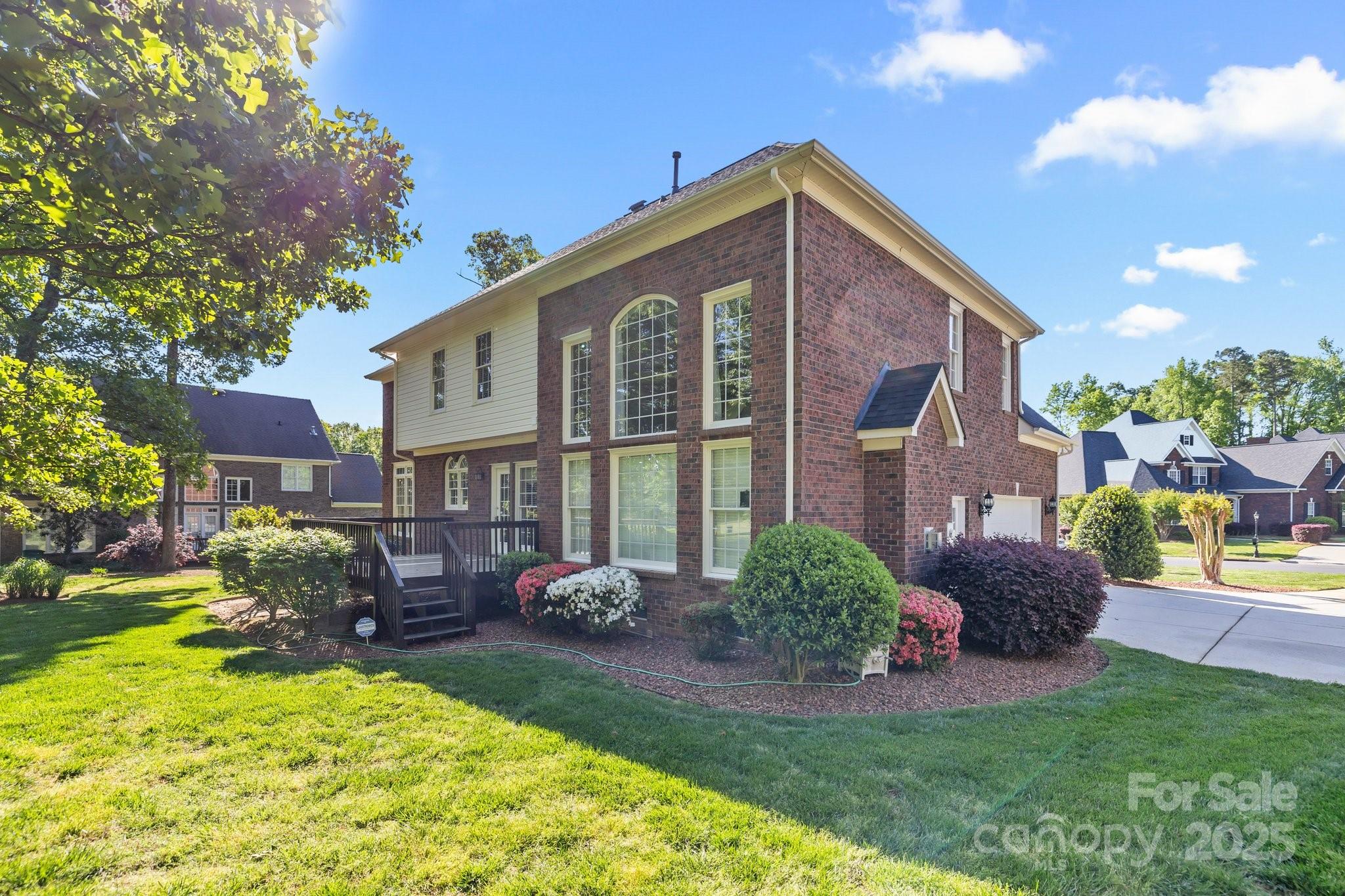 204 Limerick Drive Matthews, NC 28104 - Photo 36 of 44 a front view of a house with garden
