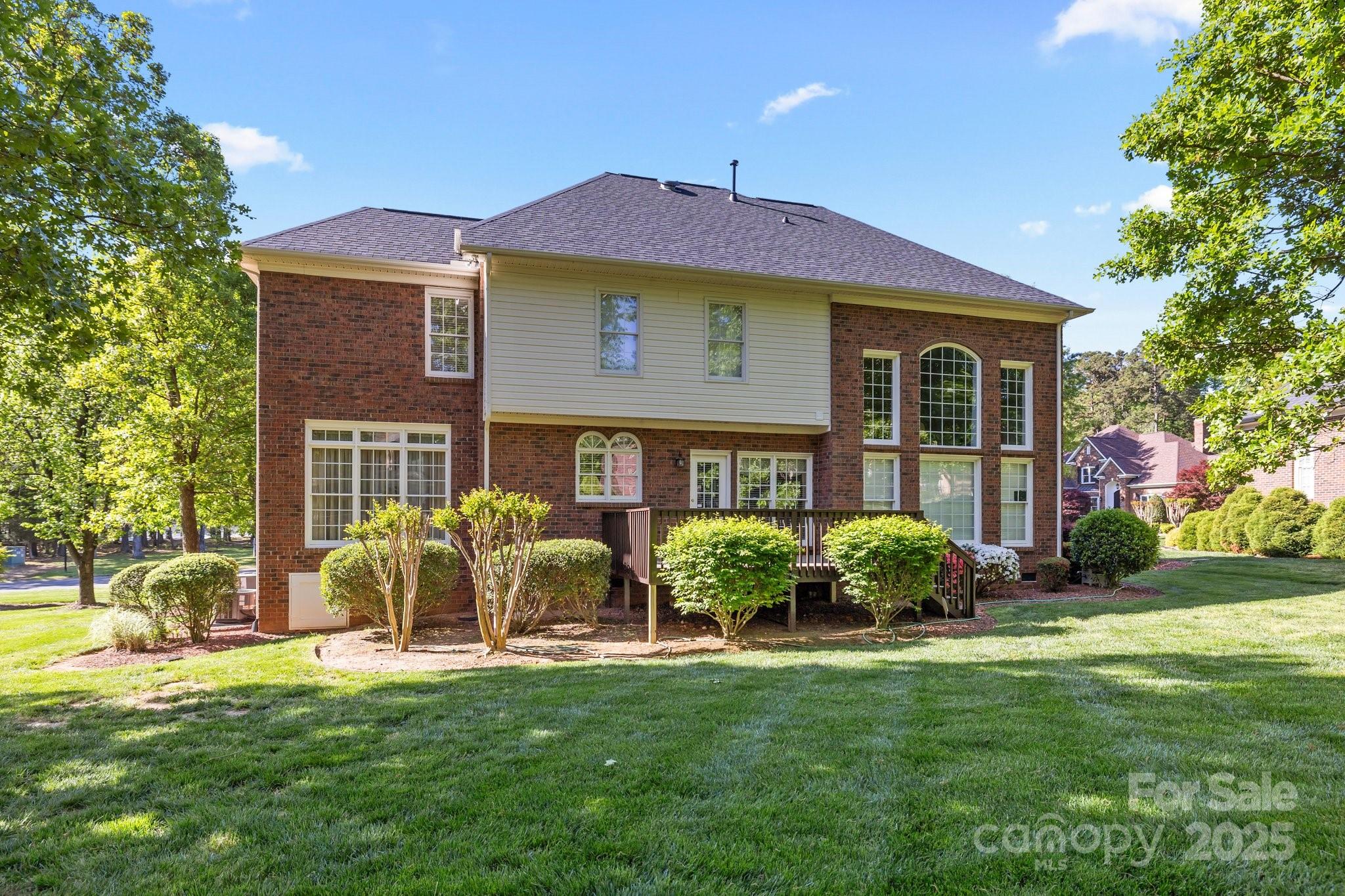 204 Limerick Drive Matthews, NC 28104 - Photo 38 of 44 a front view of a house with garden and porch