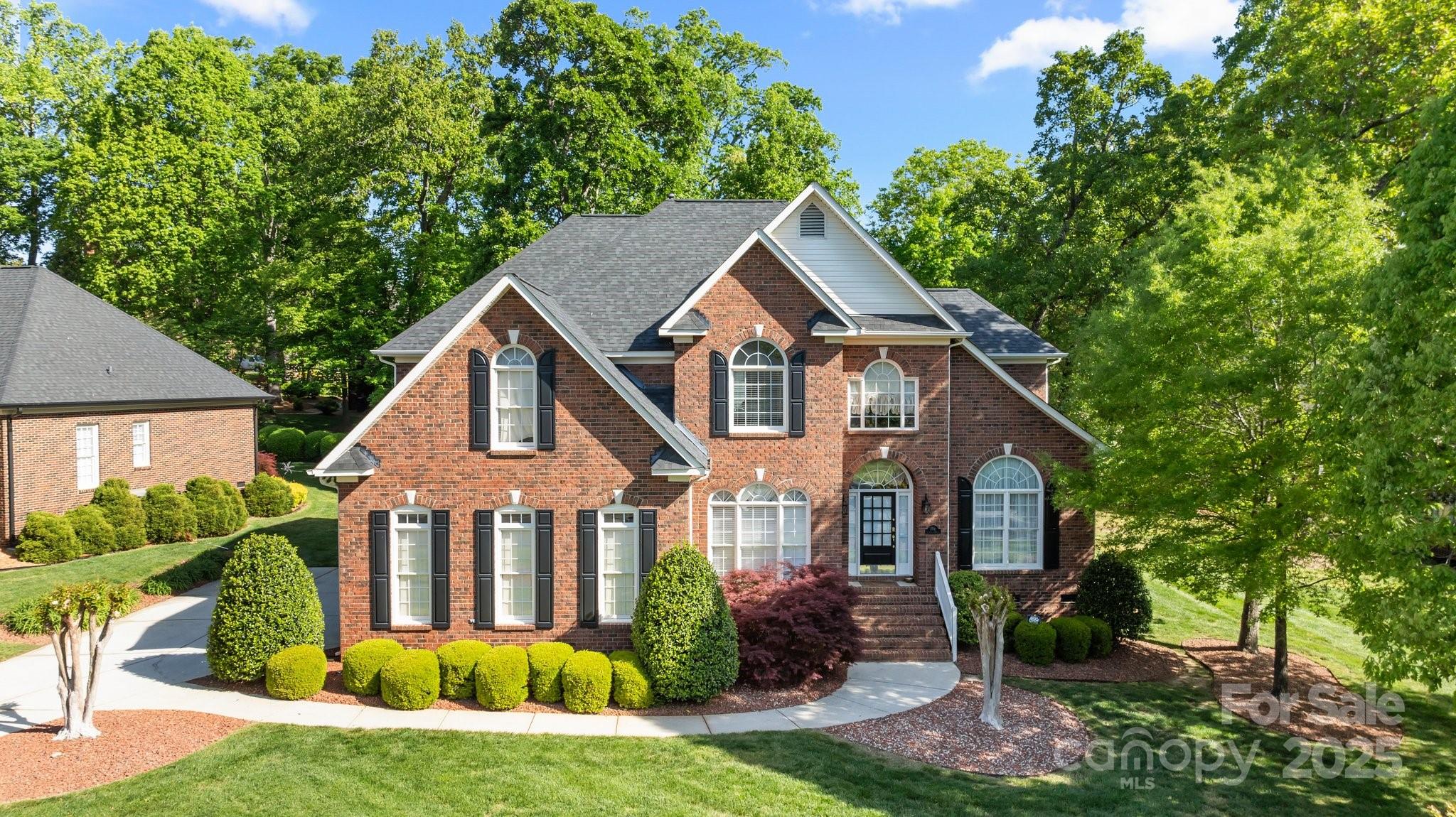 204 Limerick Drive Matthews, NC 28104 - Photo 4 of 44 a front view of a house with garden