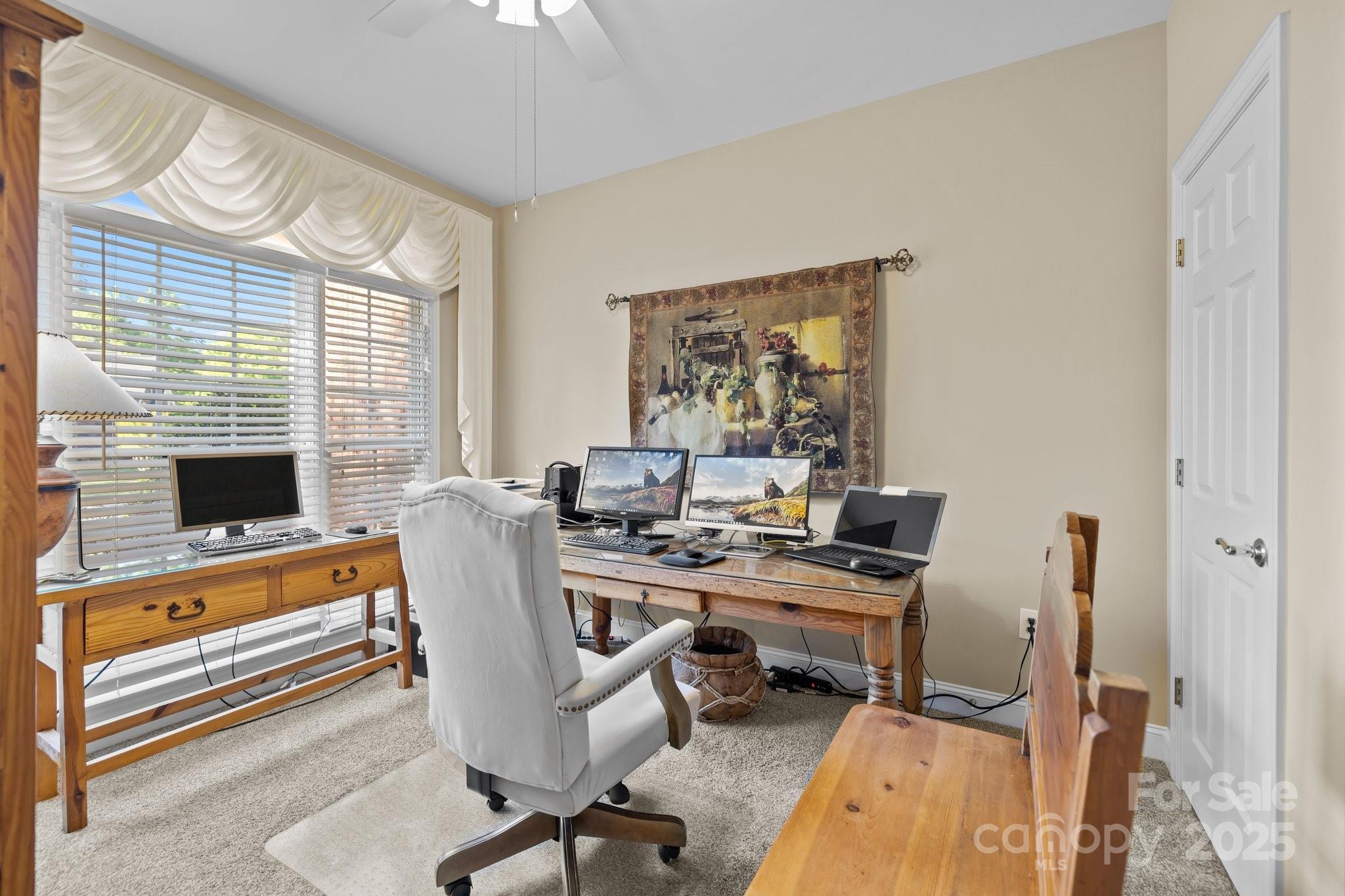 204 Limerick Drive Matthews, NC 28104 - Photo 5 of 44 a view of a workspace with furniture and a window