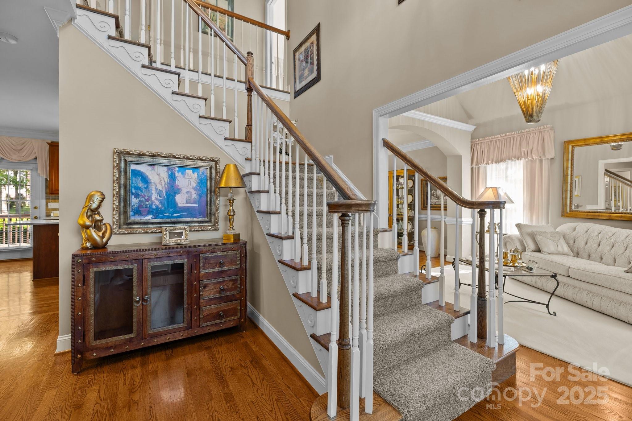 204 Limerick Drive Matthews, NC 28104 - Photo 7 of 44 a view of entryway livingroom and hall with wooden floor