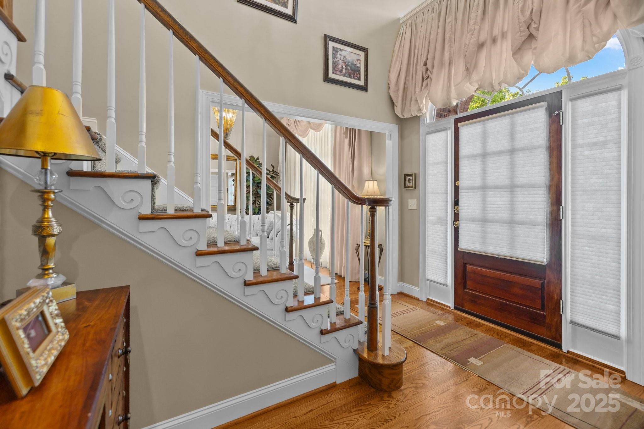 204 Limerick Drive Matthews, NC 28104 - Photo 8 of 44 a view of entryway and hall with wooden floor