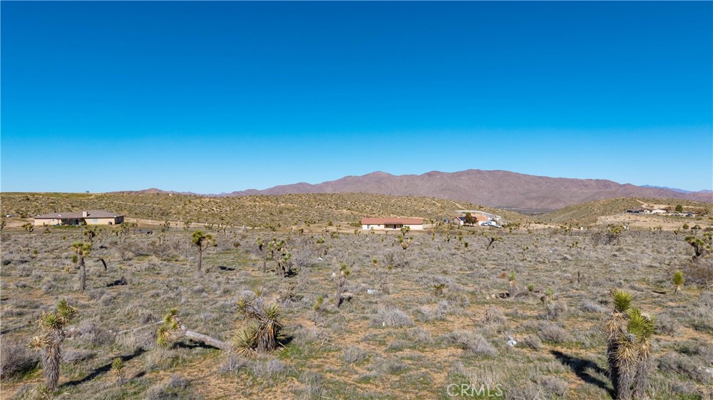 9588 Milpas Road Apple Valley, CA 92308 - Photo 11 of 22 a view of a large mountain with mountains in the background