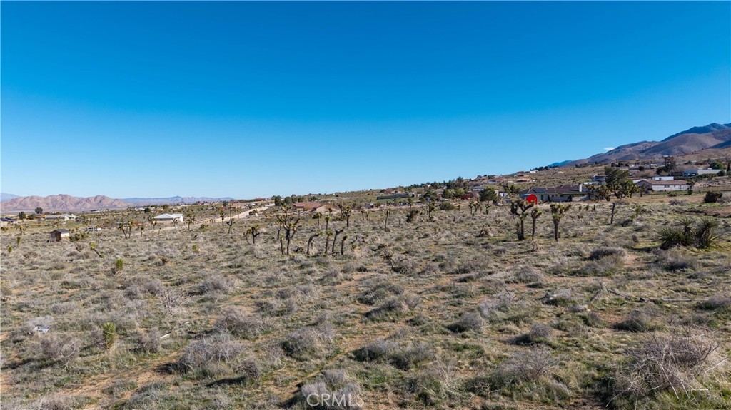 9588 Milpas Road Apple Valley, CA 92308 - Photo 10 of 22 a view of a large building with a view of mountains