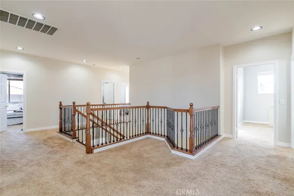 a view of a hallway with windows