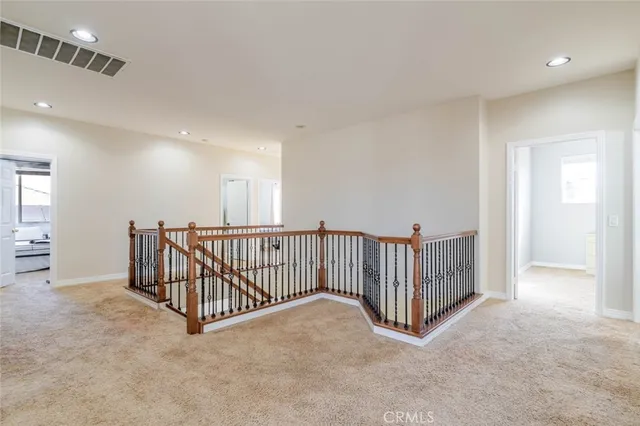 a view of a hallway with windows