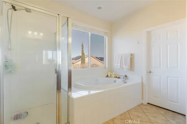 a bathroom with a bathtub and a sink