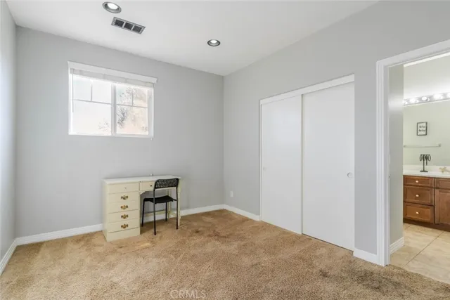 a view of room with cabinet and window