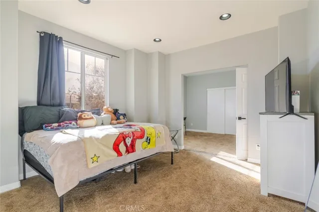 a bed room with a bed and a window