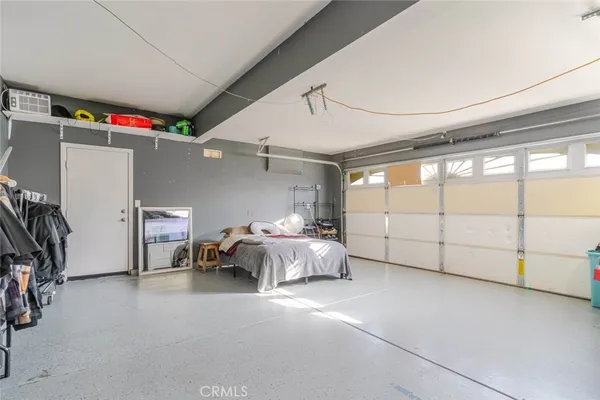 a bed room with a bed and a large window