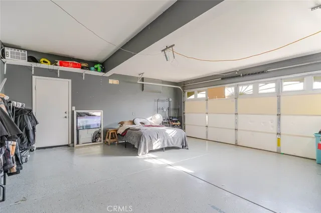 a bed room with a bed and a large window