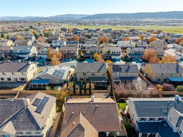 an aerial view of a house with a ocean view