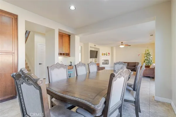 a dining room with furniture and window