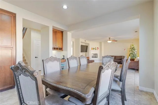 a dining room with furniture and window