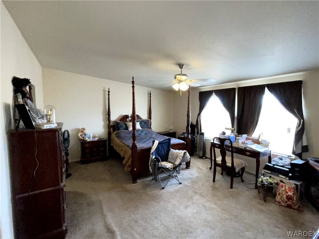 10551 East Blake Ranch Road Kingman, AZ 86401 - Photo 16 of 50 a view of a room with gym equipment