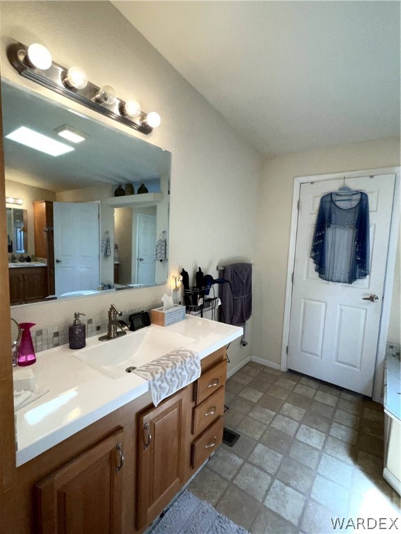 10551 East Blake Ranch Road Kingman, AZ 86401 - Photo 17 of 50 a bathroom with a sink and a mirror