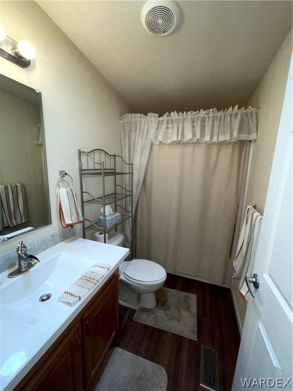 10551 East Blake Ranch Road Kingman, AZ 86401 - Photo 25 of 50 a bathroom with a sink a toilet a mirror and shower