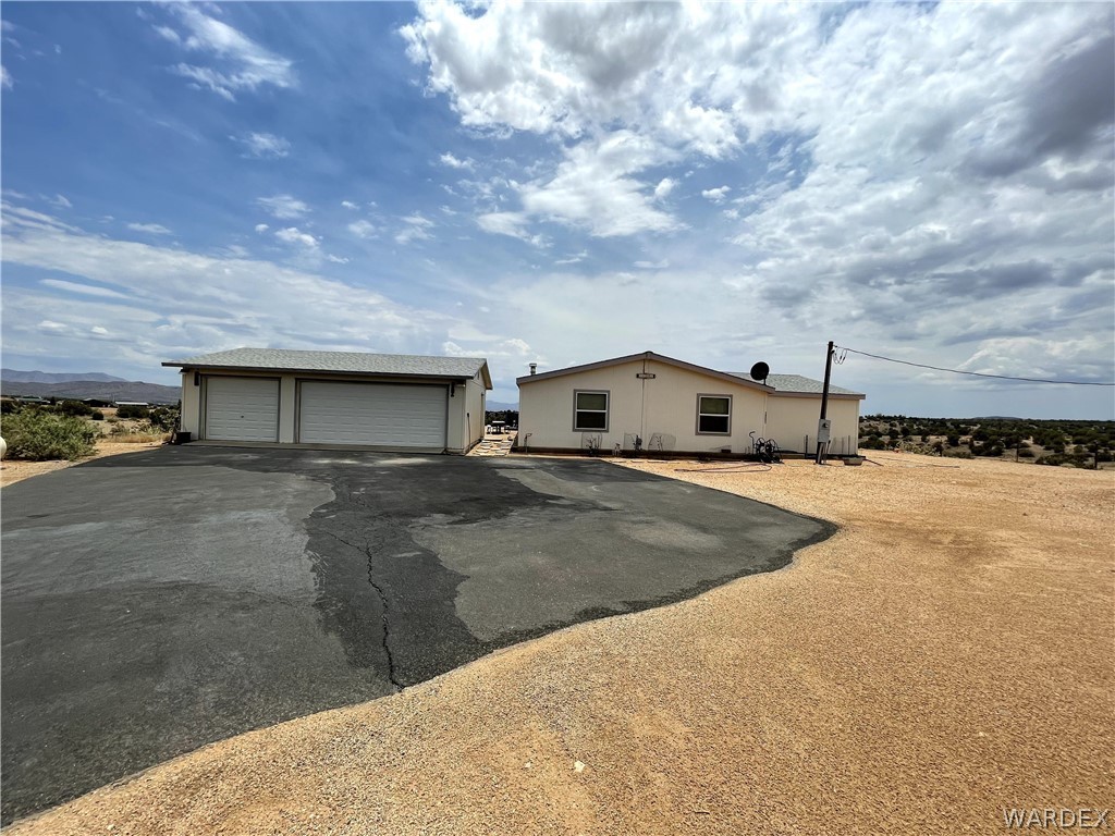 10551 East Blake Ranch Road Kingman, AZ 86401 - Photo 36 of 50 a view of a house with a street