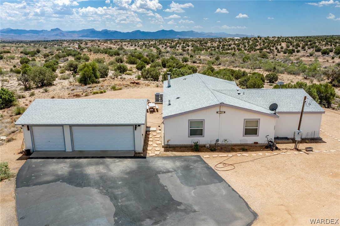 10551 East Blake Ranch Road Kingman, AZ 86401 - Photo 43 of 50 a view of a house with a yard