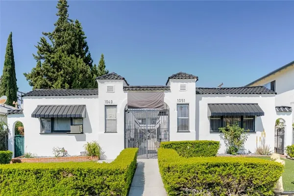 front view of a house with a garden