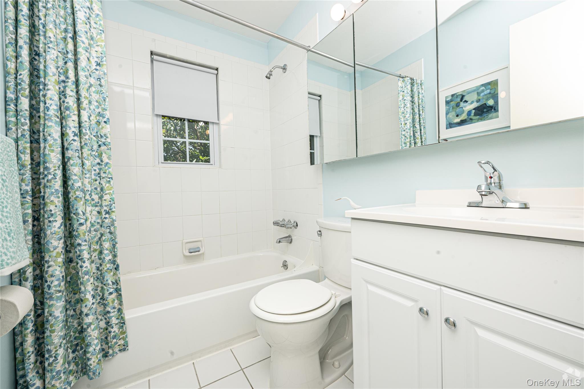 5 Commodore Lane West Babylon, NY 11704 - Photo 8 of 12 a bathroom with a sink a toilet and a bathtub
