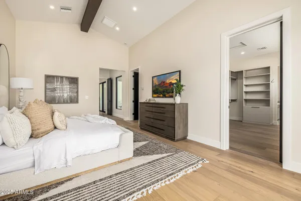 a view of an empty room and wooden floor
