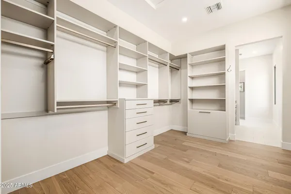 a view of an empty walk in closet