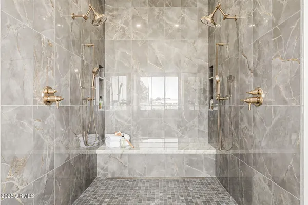 a view of an empty room with wooden floor and closet