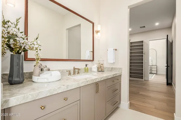 a kitchen with granite countertop a sink and cabinets