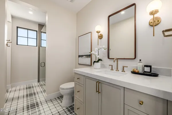 a front view of a house with swimming pool having outdoor seating