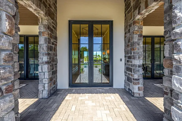 a balcony with wooden floor and furniture