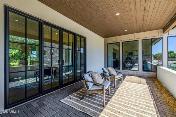 a view of living room with furniture and window