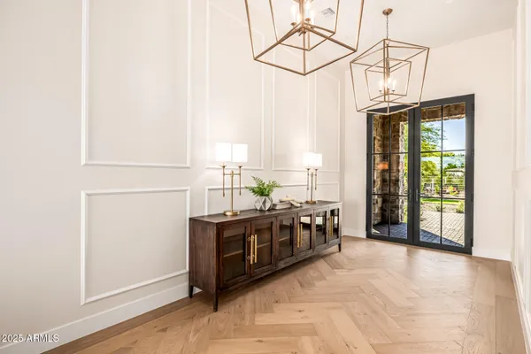 a living room with furniture a flat screen tv and a floor to ceiling window