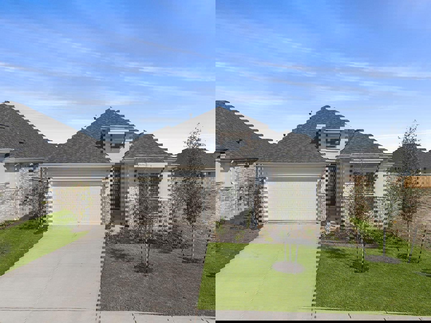 a front view of house with a garden