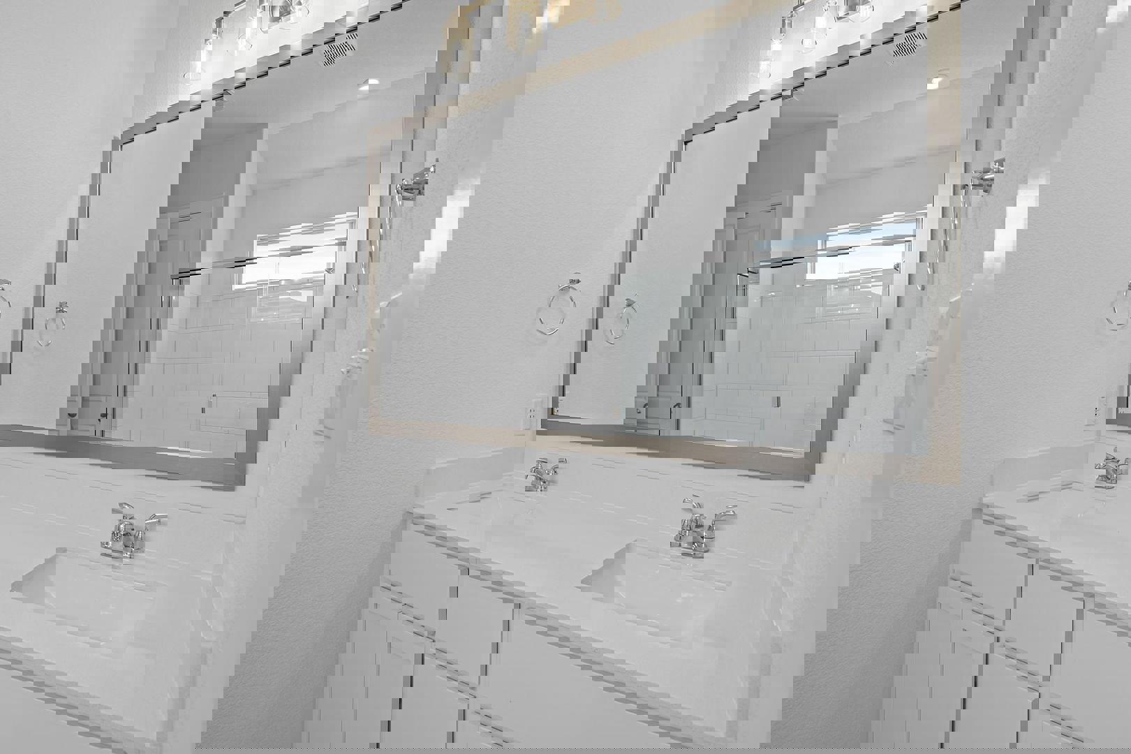 429 Brandywine Road Hutto, TX 78634 - Photo 13 of 28 a bathroom with a sink and a mirror