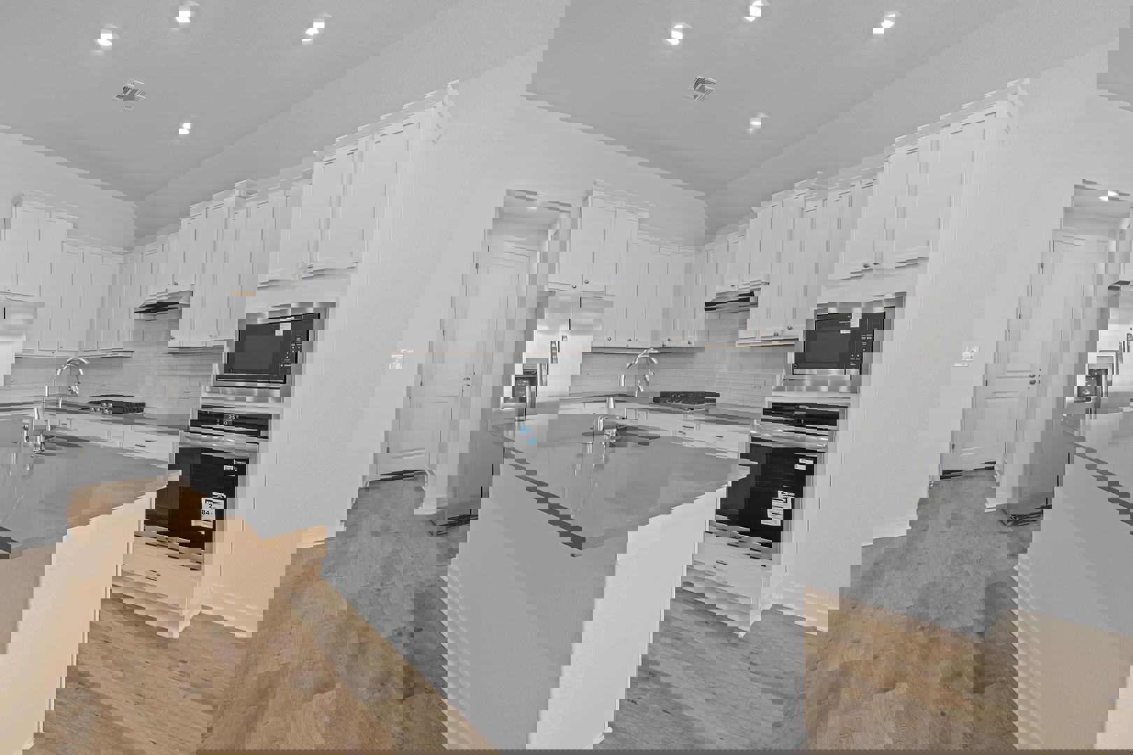 429 Brandywine Road Hutto, TX 78634 - Photo 5 of 28 a kitchen with a sink stove and refrigerator