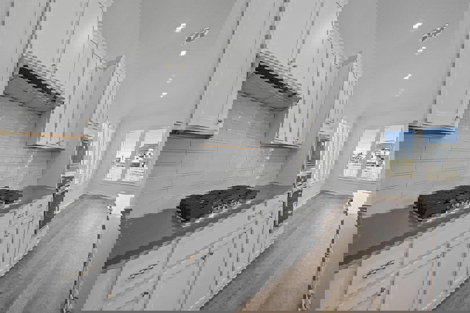 429 Brandywine Road Hutto, TX 78634 - Photo 6 of 28 a kitchen with white cabinets and appliances