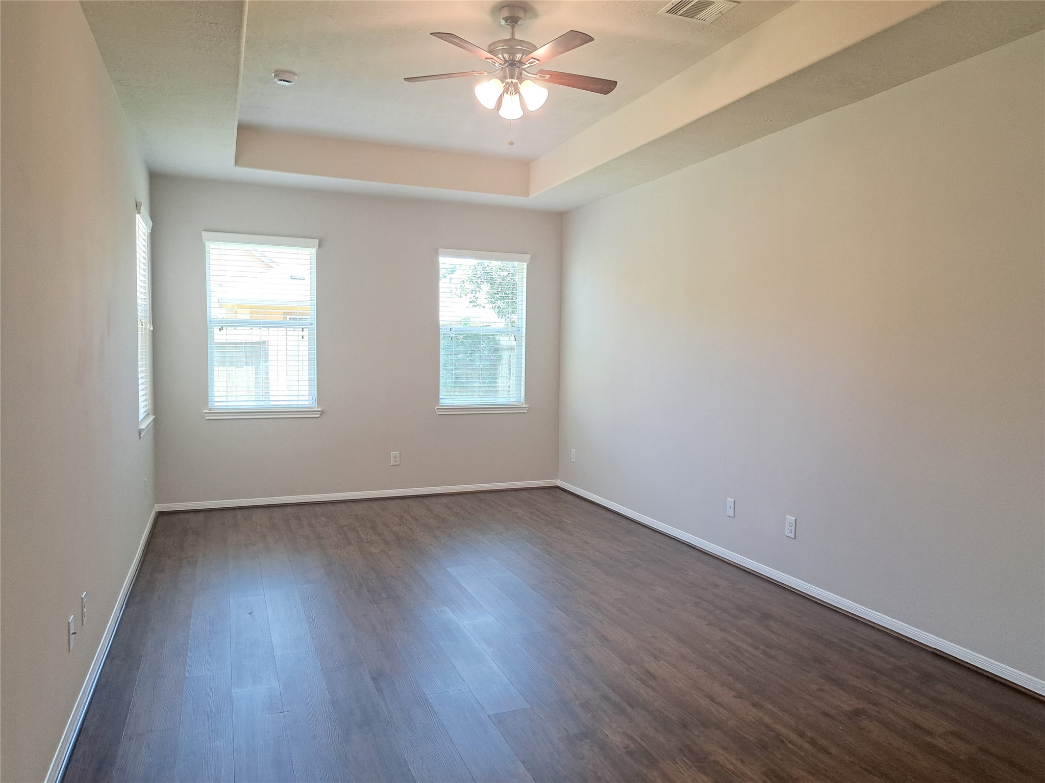 26315 Fox Ridge Lane Katy, TX 77494 - Photo 17 of 39 a view of an empty room with wooden floor and a window