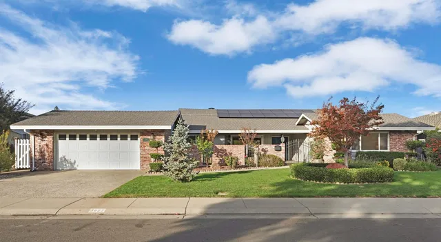 front view of house with a yard