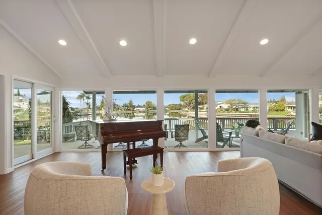 a dining room with furniture and wooden floor
