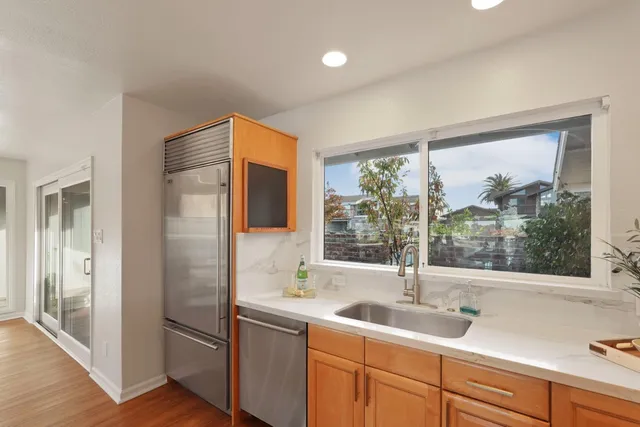 a kitchen with stove and cabinets