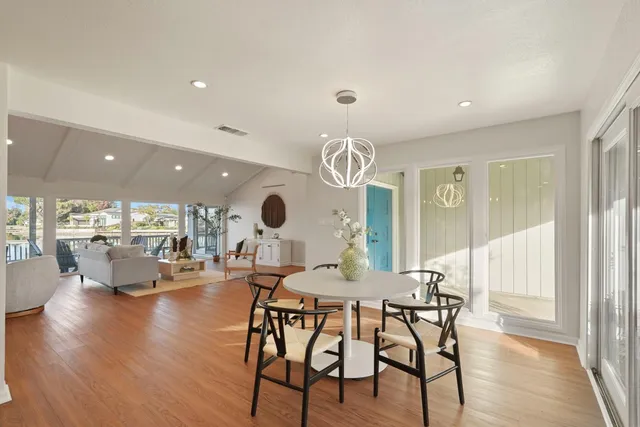 a living room with fireplace furniture and a wooden floor