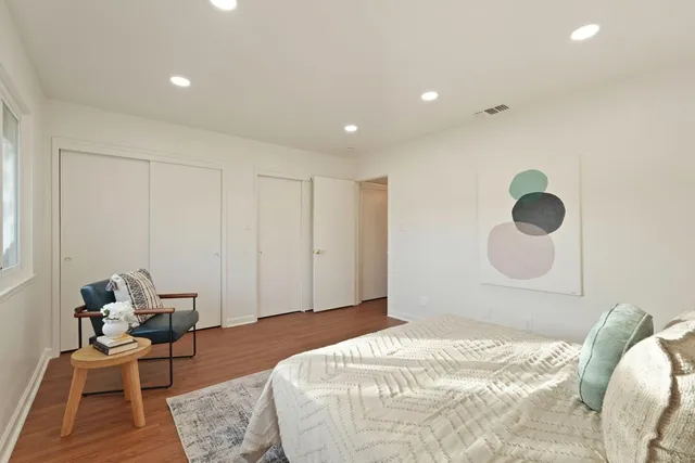 a bathroom with a sink a large mirror and vanity