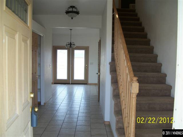 2950 Scowens Road Reno, NV 89506 - Photo 2 of 13 a view of a hallway with windows and chandelier