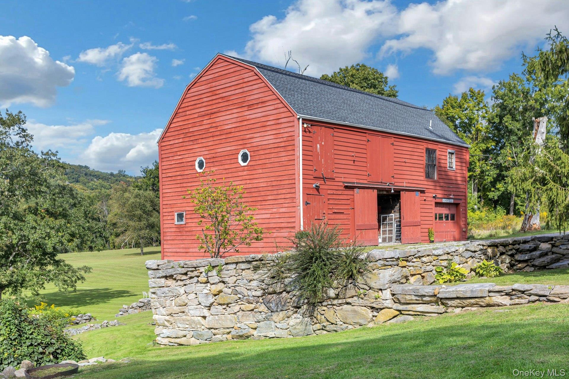 75 Cushman Road Patterson, NY 12563 - Photo 26 of 45 Totally renovated original barn with party room, full kitchen, full bath, two bedroom apartment and 3 car garage.