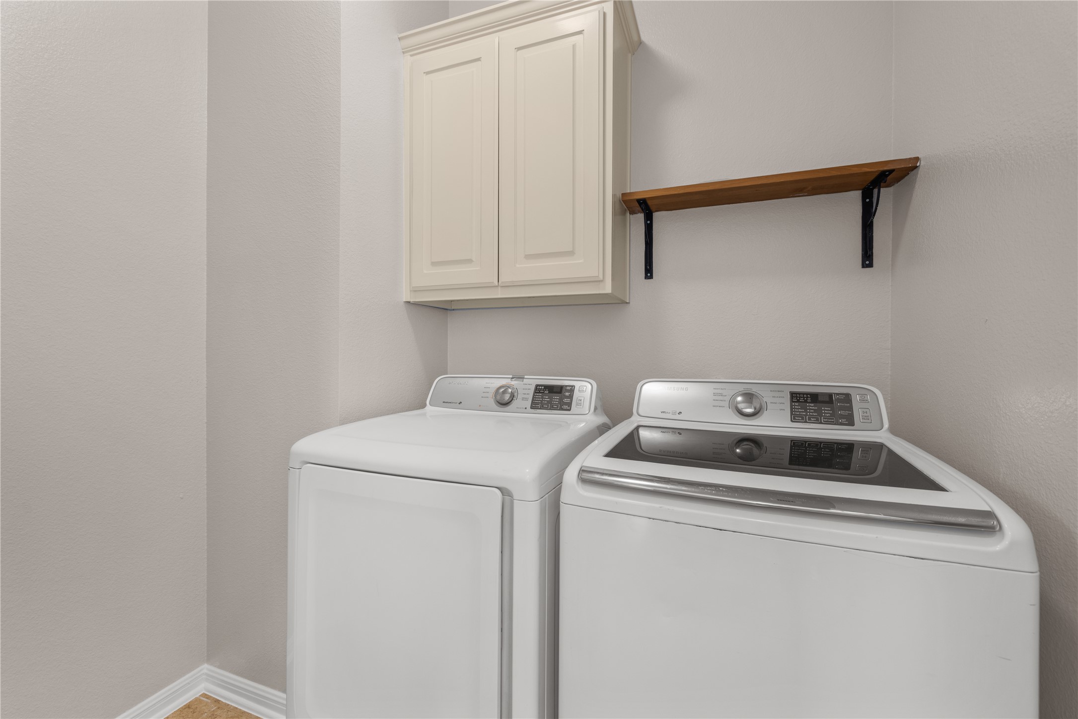 11000 Anderson Mill Road, Unit 45 Austin, TX 78750 - Photo 17 of 32 a utility room with dryer and washer