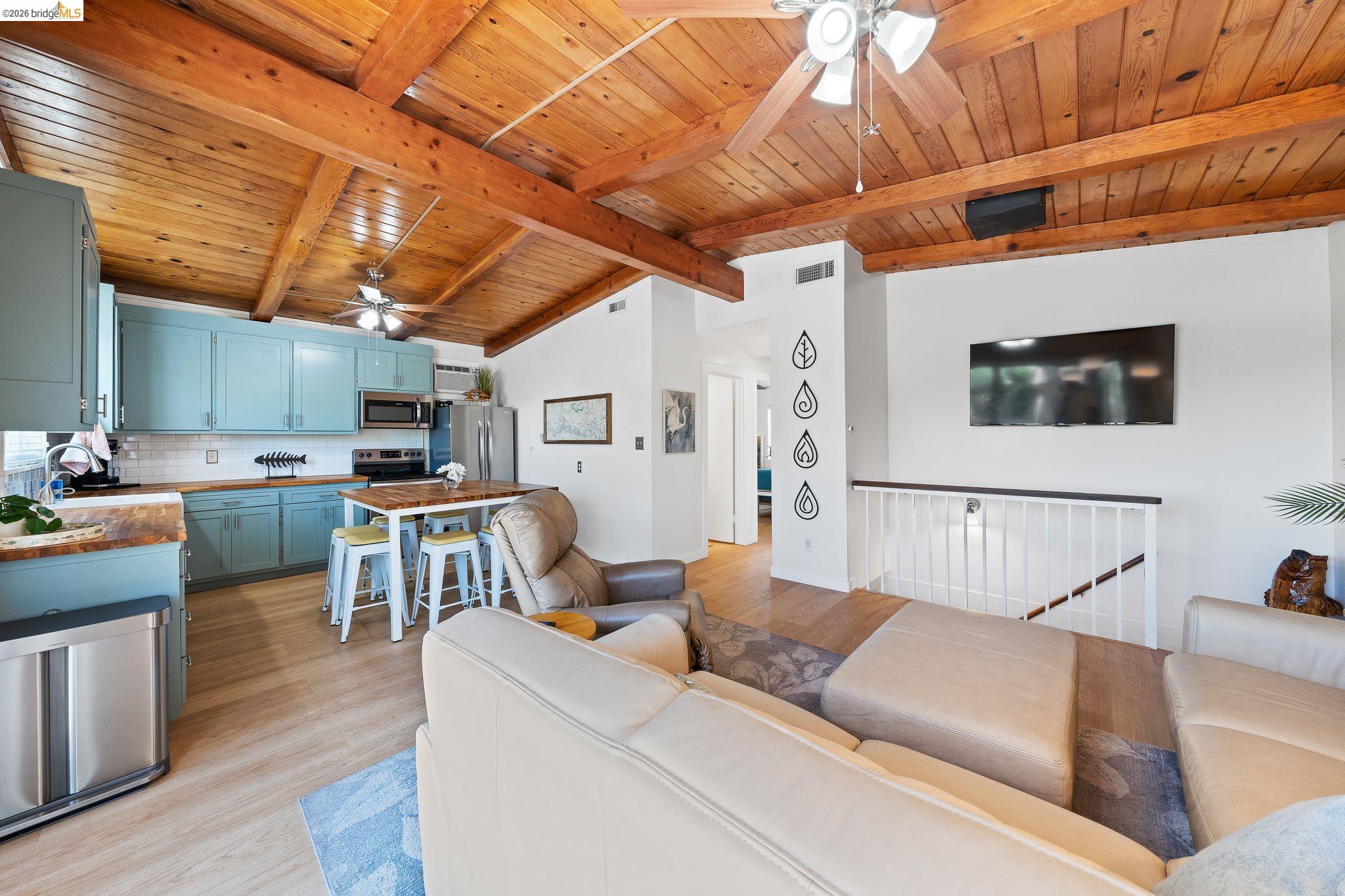 1704 Taylor Road Bethel Island, CA 94511 - Photo 22 of 73 Vaulted wood-finish ceiling with exposed beams and ceiling fans