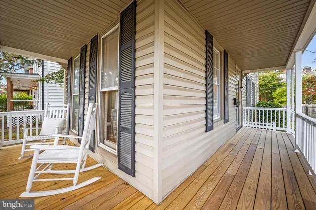 a view of a balcony with wooden floor