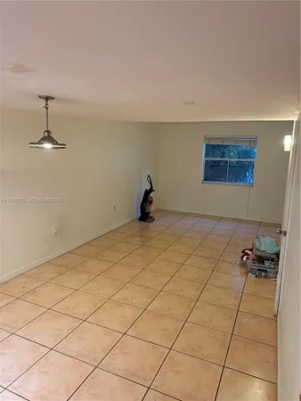 a bedroom with a bed and a lamp on table